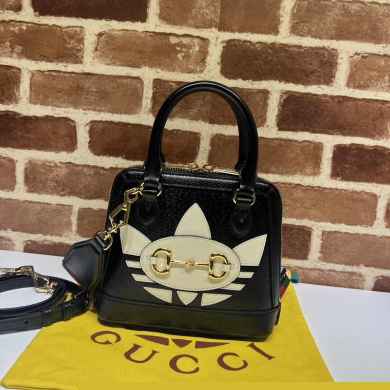 G*u*i top handle bags